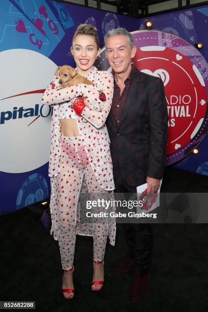 Miley Cyrus and Elvis Duran attend the 2017 iHeartRadio Music Festival at T-Mobile Arena on September 23, 2017 in Las Vegas, Nevada.