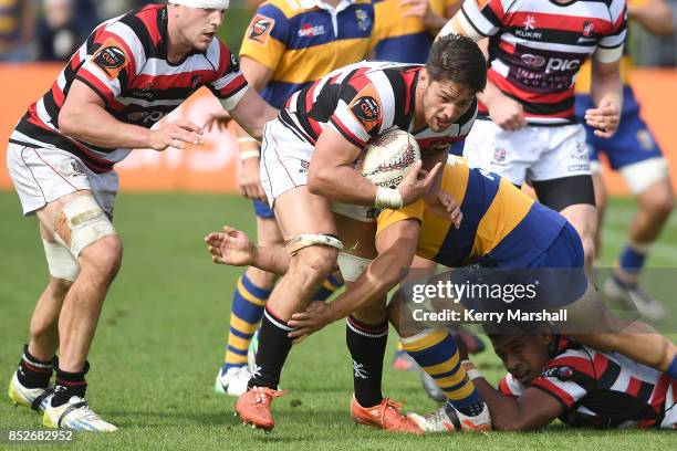 Samuel Henwood of Counties Manukau tries to avoid a tackle during the round six Mitre 10 Cup match between Bay of Plenty and Counties Manukau...