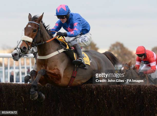 Cue Card and Joe Tizzard on their way to victory in the Betfair Chase during the Betfair Chase Festival at Haydock Park Racecourse, Newton-le-Willows.