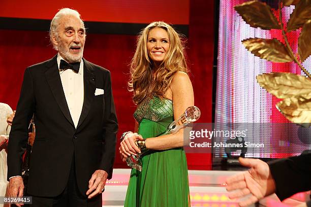 Actor Christopher Lee and model Elle Macpherson chat together during the Women's World Awards show on February 5, 2009 in Vienna, Austria.