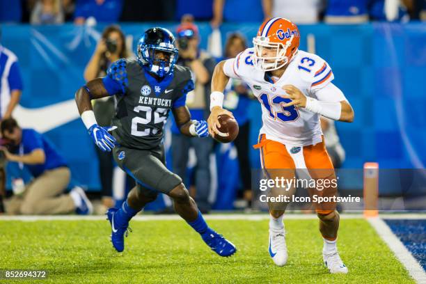 Florida quarterback Feleipe Franks tries to avoid a sack by Kentucky safety Darius West during a regular season college football game between the...