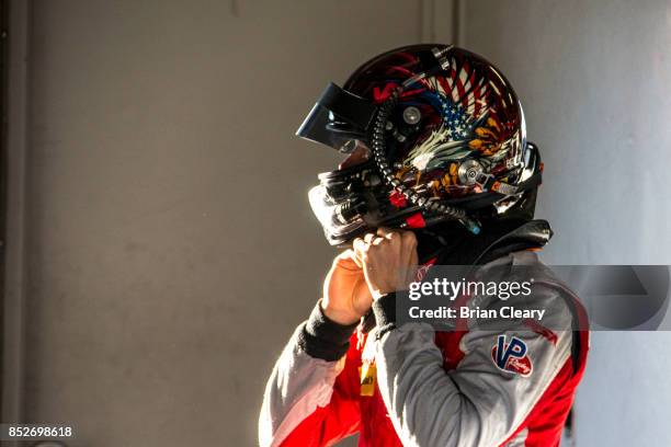 Lawson Aschenbach prepares to drive during qualifying for the IMSA WeatherTech Sportscar Series race at Mazda Raceway Laguna Seca on September 23,...