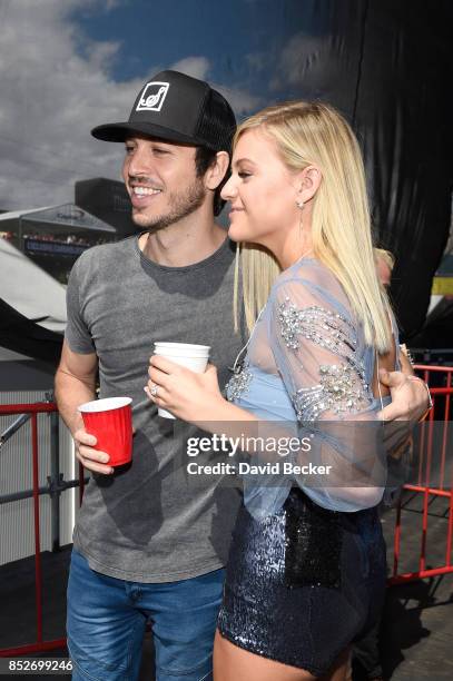 Morgan Evans and Kelsea Ballerini backstage during the Daytime Village Presented by Capital One at the 2017 HeartRadio Music Festival at the Las...