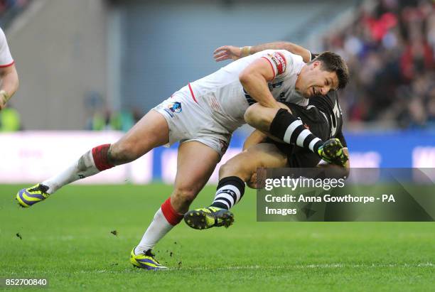 England's Gareth Widdop tackles New Zealand's Jason Nightingale during the World Cup Semi Final at Wembley Stadium, London.