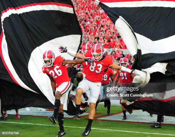 Tyrique McGee and Jeb Blazevich of the Georgia Bulldogs take the field before the game against the Mississippi State Bulldogs at Sanford Stadium on...