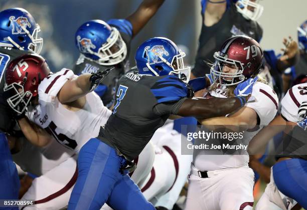 Curtis Akins of the Memphis Tigers blocks against Ben Bailey of the Southern Illinois Salukis on September 23, 2017 at Liberty Bowl Memorial Stadium...