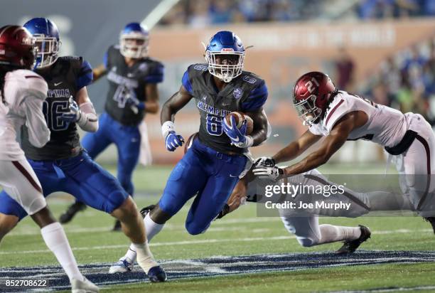 Patrick Taylor of the Memphis Tigers runs against Ryan Neal of the Southern Illinois Salukis on September 23, 2017 at Liberty Bowl Memorial Stadium...