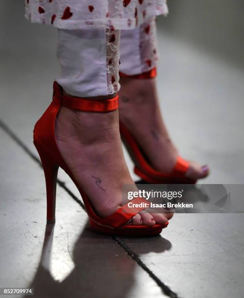 Miley Cyrus, shoe detail, attends the 2017 iHeartRadio Music Festival at T-Mobile Arena on September 23, 2017 in Las Vegas, Nevada.