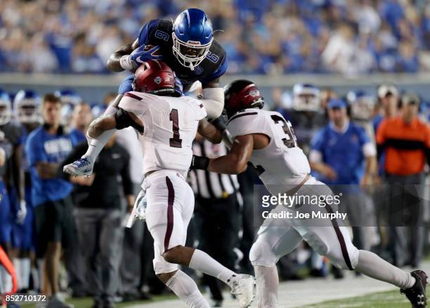 Patrick Taylor of the Memphis Tigers is tackled by Craig James and Kyron Watson of the Southern Illinois Salukis on September 23, 2017 at Liberty...