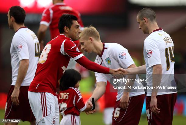 Nottingham Forest's Gonzalo Jara and Burnley's David Jones shake hands before the game