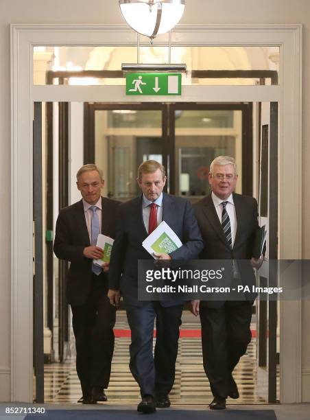Jobs Minister Richard Bruton, Taoiseach Enda Kenny and Taniste Eamon Gilmore hold a press conference on job creation at Government Buildings, Ireland.