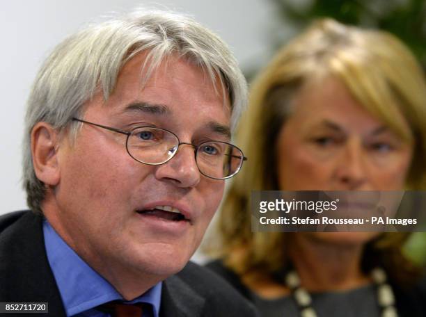Andrew Mitchell and his wife Dr Sharon Bennett during a press conference in London, as he gives his reaction to the Crown Prosecution Service...