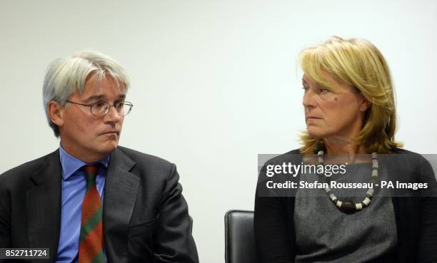 Andrew Mitchell and his wife Dr Sharon Bennett during a press conference in London, as he gives his reaction to the Crown Prosecution Service...