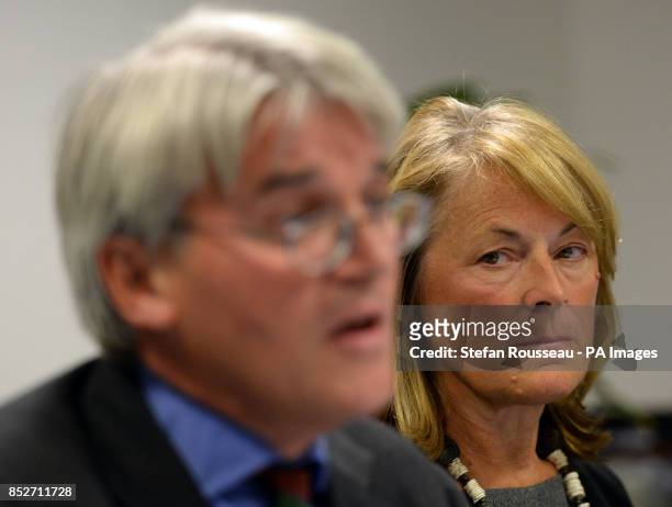 Dr Sharon Bennett watches her husband Andrew Mitchell speak, during a press conference in London, as he gives his reaction to the Crown Prosecution...