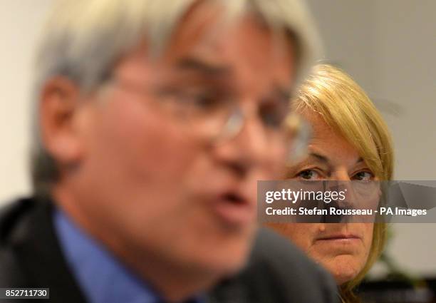 Dr Sharon Bennett watches her husband Andrew Mitchell speak, during a press conference in London, as he gives his reaction to the Crown Prosecution...