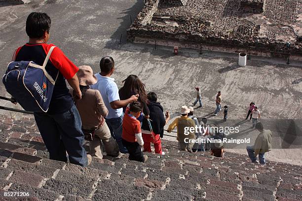 Tourists descend down the steps of the Pyramid of the Moon on February 07, 2009 in Teotihuacan, Mexico. The ancient pre-hispanic site of Teotihuacan,...