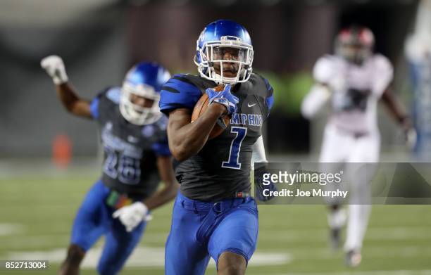 Tony Pollard of the Memphis Tigers runs back a kickoff for a touchdown against the Southern Illinois Salukis on September 23, 2017 at Liberty Bowl...