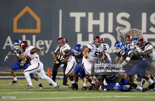 Jonathan Mixon of the Southern Illinois Salukis runs with the ball against Austin Hall of the Memphis Tigers on September 23, 2017 at Liberty Bowl...