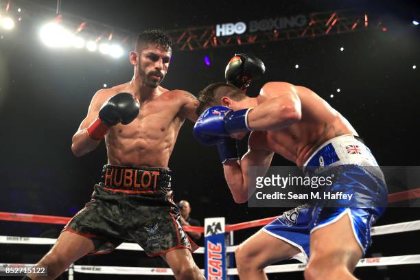 Jorge Linares of Venezuela exchanges punches with Luke Campbell of Great Britain during their WBA lightweight title bout at The Forum on September...