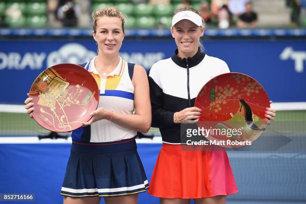 Anastasia Pavlyuchenkova of Russia and Caroline Wozniacki of Denmark pose during the trophy presentation after Wozniacki defeated Pavlyuchenkova in...