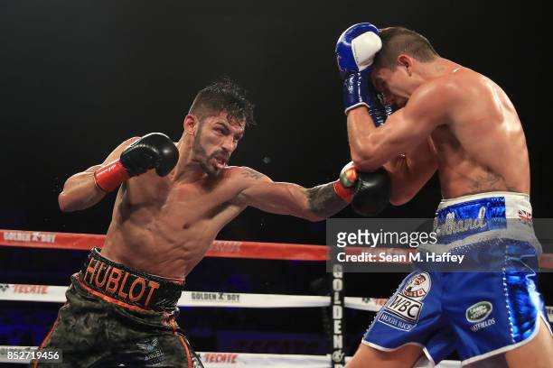 Jorge Linares of Venezuela exchanges punches with Luke Campbell of Great Britain during their WBA lightweight title bout at The Forum on September...
