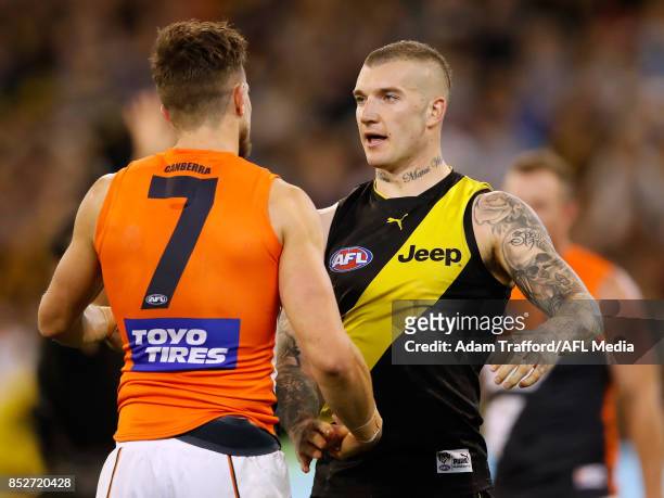 Dustin Martin of the Tigers consoles former Tigers teammate Brett Deledio of the Giants after the Tigers made it through to the grand final in...
