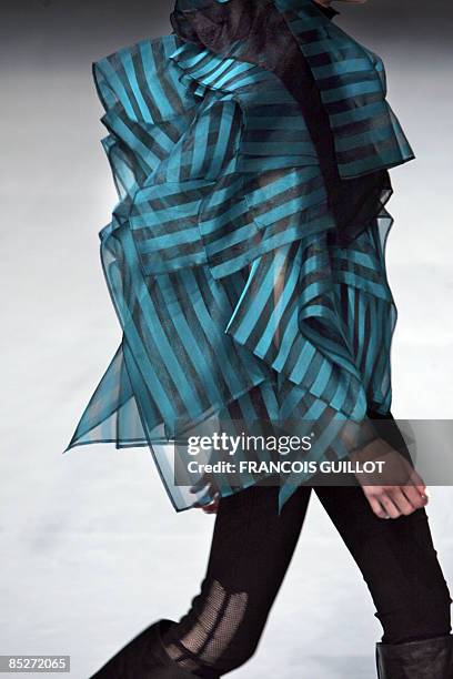 Model presents a creation by Japanese designer Dai Fujiwara for Issey Miyake during the autumn/winter 2009 ready-to-wear collection show in Paris, on...