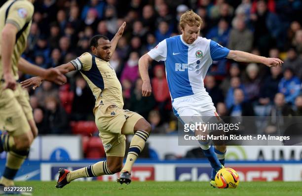 Blackburn Rovers Chris Taylor is challenged by Leeds United's Rodolph Austin during the Sky Bet Championship match at Ewood Park, Blackburn.