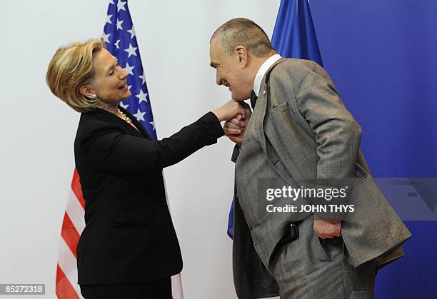 Czech Foreign Minister Karel Schwarzenberg welcomes US Secretary of State Hillary Clinton prior to their bilateral meeting in Brussels on March 6,...