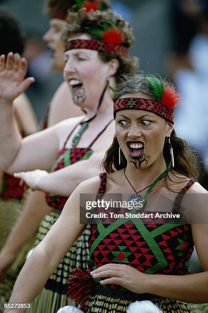 Troupe of traditional Maori dancers perform during the Queen's tour of New Zealand, February 1986.