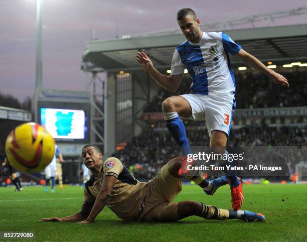 Blackburn Rover's Tommy Spurr battles for the ball with Leeds United's Lee Peltier during the Sky Bet Championship match at Ewood Park, Blackburn.