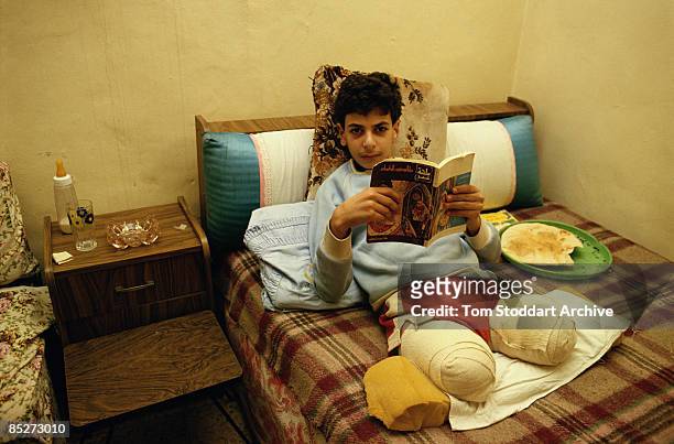 Palestinian boy who lost both his legs during the Lebanese Civil War, 1989.