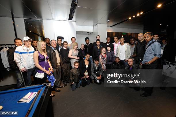 Chelsea team pose with the clic sargent famlies during the Chelsea FC and Armani charity party at The Armani Store, Brompton Road where the proceeds...