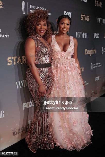 Actress's Ta'Rhonda Jones and Amiyah Scott pose on the red carpet during the "Empire" & "Star" Celebrate FOX's New Wednesday Night at One World...