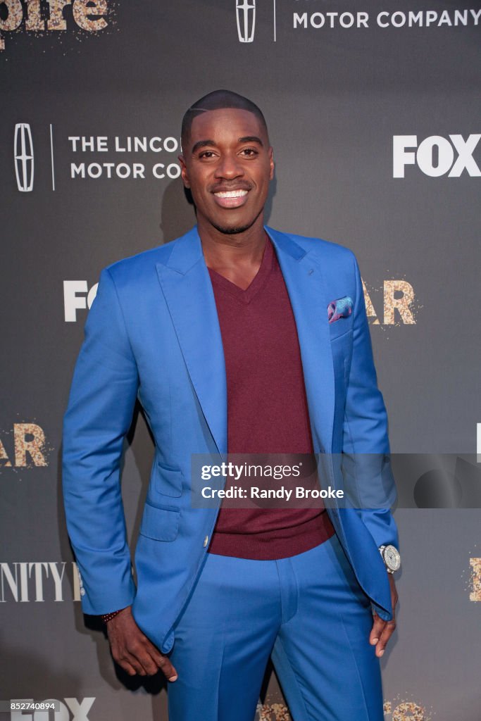 Warren Hall) poses on the red carpet during the "Empire" & "Star