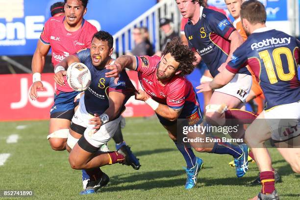 Billy Guyton of Tasman tries to stop Neria Fomai of Southland getting the ball out to his backs during the round six Mitre 10 Cup match between...