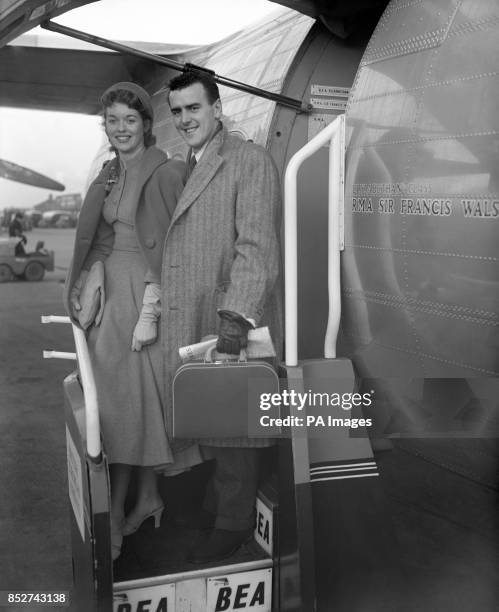 George Cole and his bride Eileen Moore pictured as they boarded a BEA liner at London Airport for a honeymoon in Paris. The couple, who met when both...