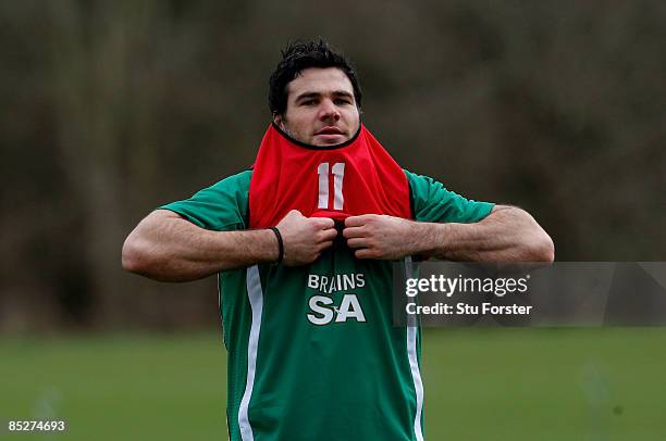 Wales scrum half Mike Phillips puts on his bib during Wales Rugby Union training at The Vale Resort on March 6, 2009 in Cardiff, Wales.