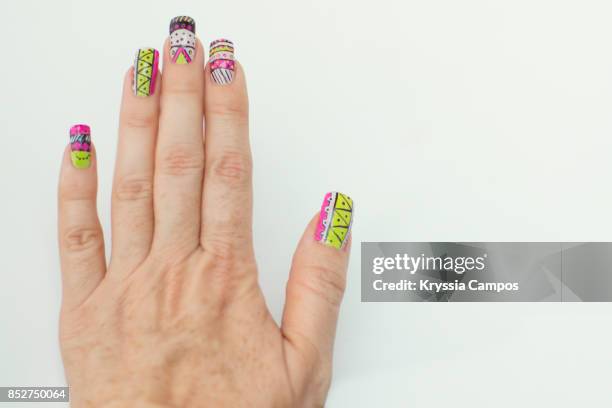 hand showing design nail art - multi coloured nails stock pictures, royalty-free photos & images