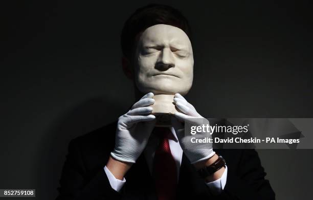 Sir Isaac Newton's death mask is part of an exhibition of 150 fascinating items from Edinburgh University's collection displayed at it's main library...