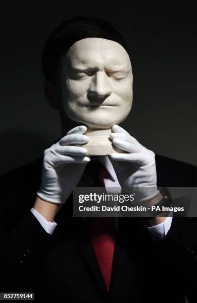 Sir Isaac Newton's death mask is part of an exhibition of 150 fascinating items from Edinburgh University's collection displayed at it's main library...