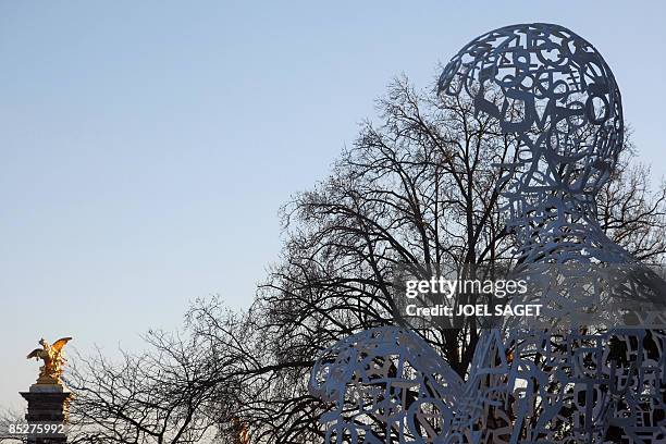 Picture taken on March 6, 2009 in front of the "Grand Palais" in Paris of a sculpture named "Nosotros" by Spanish artist Jaume Plensa, exhibited as...