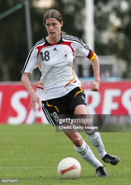 Kerstin Garefrekes runs with the ball during the Women Algarve Cup match between Germany and China at the Municipal stadium on March 6, 2009 in...