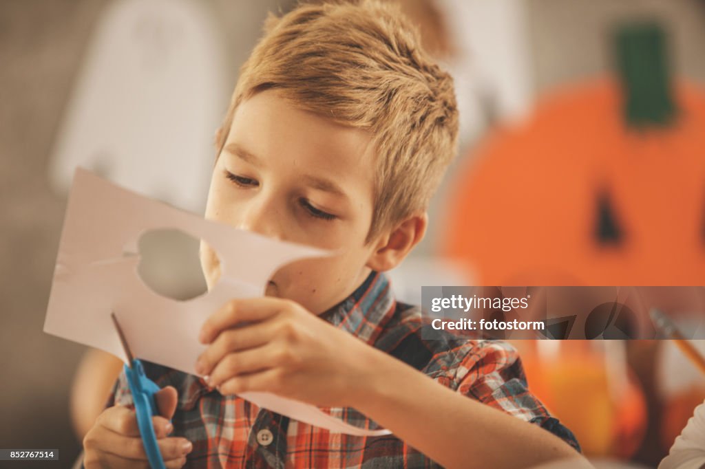 Boy cutting paper