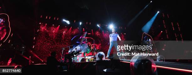 Chris Martin of Coldplay performs on stage at CenturyLink Field on September 23, 2017 in Seattle, Washington.
