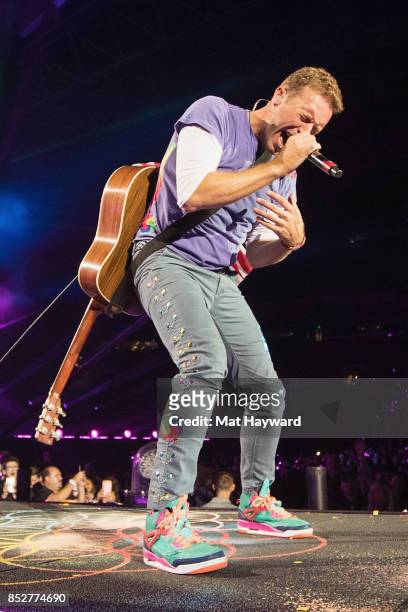 Chris Martin of Coldplay performs on stage at CenturyLink Field on September 23, 2017 in Seattle, Washington.