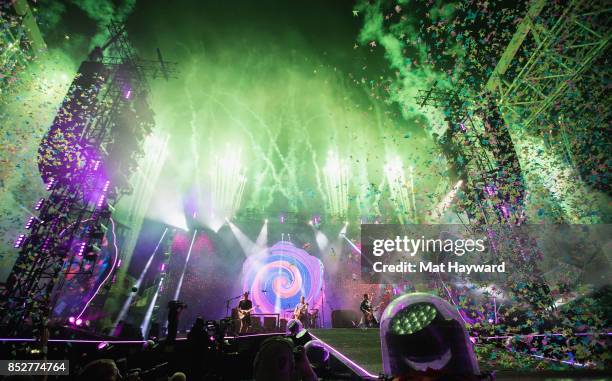 Jonny Buckland, Will Champion, Chris Martin and Guy Berryman of Coldplay perform on stage at CenturyLink Field on September 23, 2017 in Seattle,...