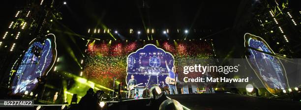 Jonny Buckland, Will Champion, Chris Martin and Guy Berryman of Coldplay perform on stage at CenturyLink Field on September 23, 2017 in Seattle,...