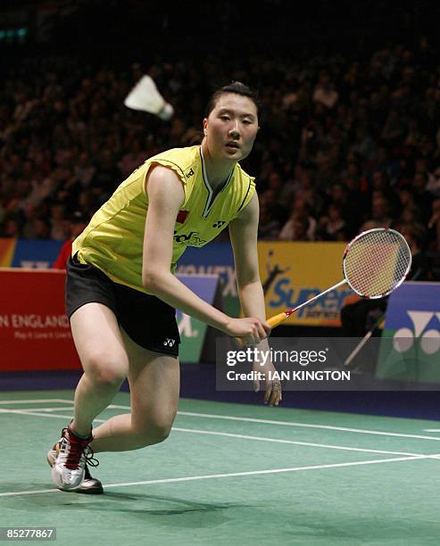 Lu Lan of China plays in her women's singles quarter final match against Jiang Yanjiao of China during All England Open Badminton Championships at...