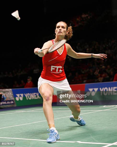 Tine Rasmussen of Denmark returns a shot in her women's singles quarter final match against Yip Pui Yin of Hong Kong during the Badminton All England...